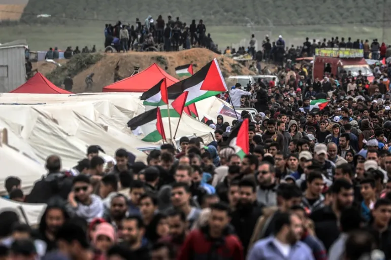Palestinians demonstrating on the eastern Gaza border, during the 2018 Great March of Return