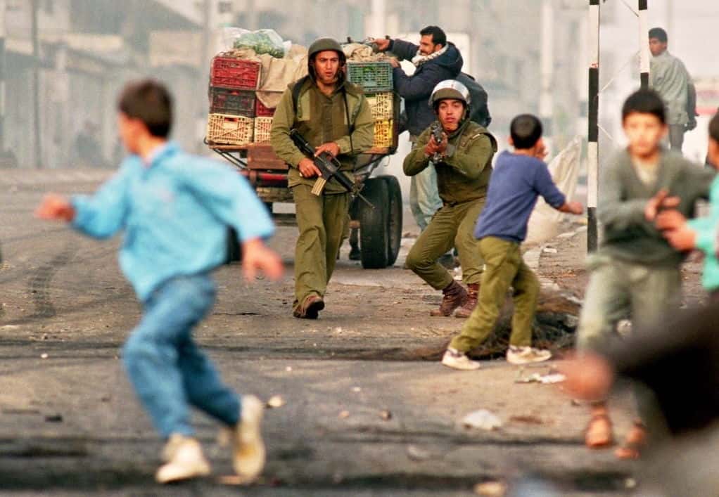 Palestinian children fleeing IOF terrorists in First Intifada