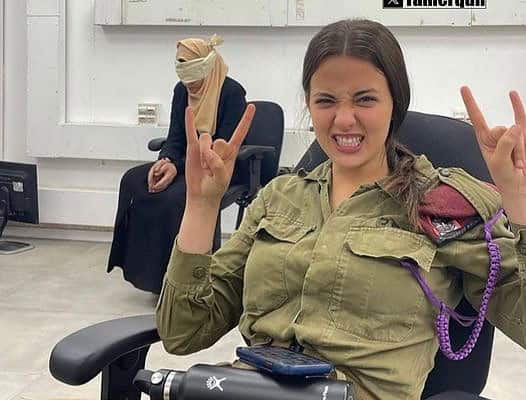 Palestinian woman blindfolded while IOF terrorist takes a selfie