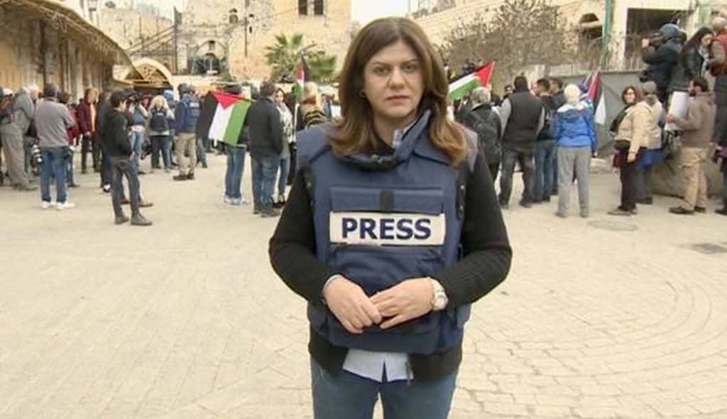 Shireen Abu Akleh on the scene in a Press Vest.