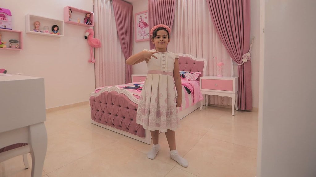 Tala Abu Ajwa in her pink bedroom.